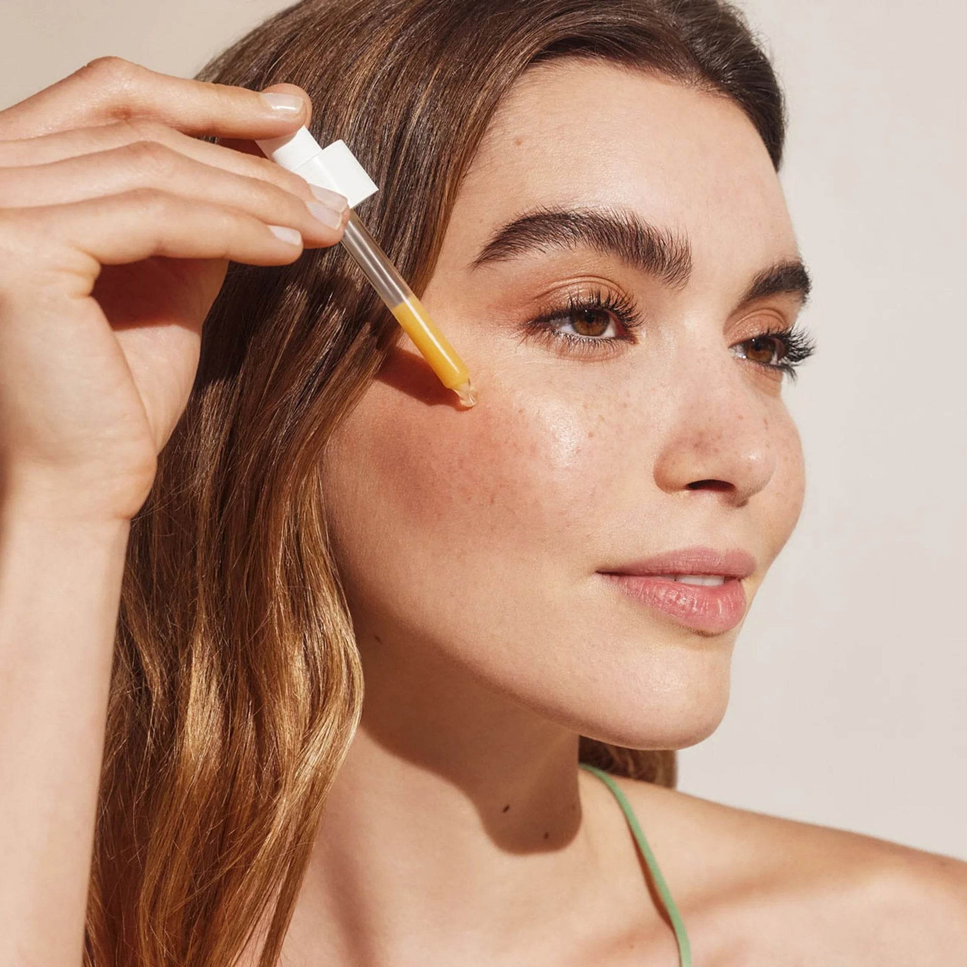 Natura Bissé Blemish, Oil, and Pore Control Serum being applied to skin for a clear complexion