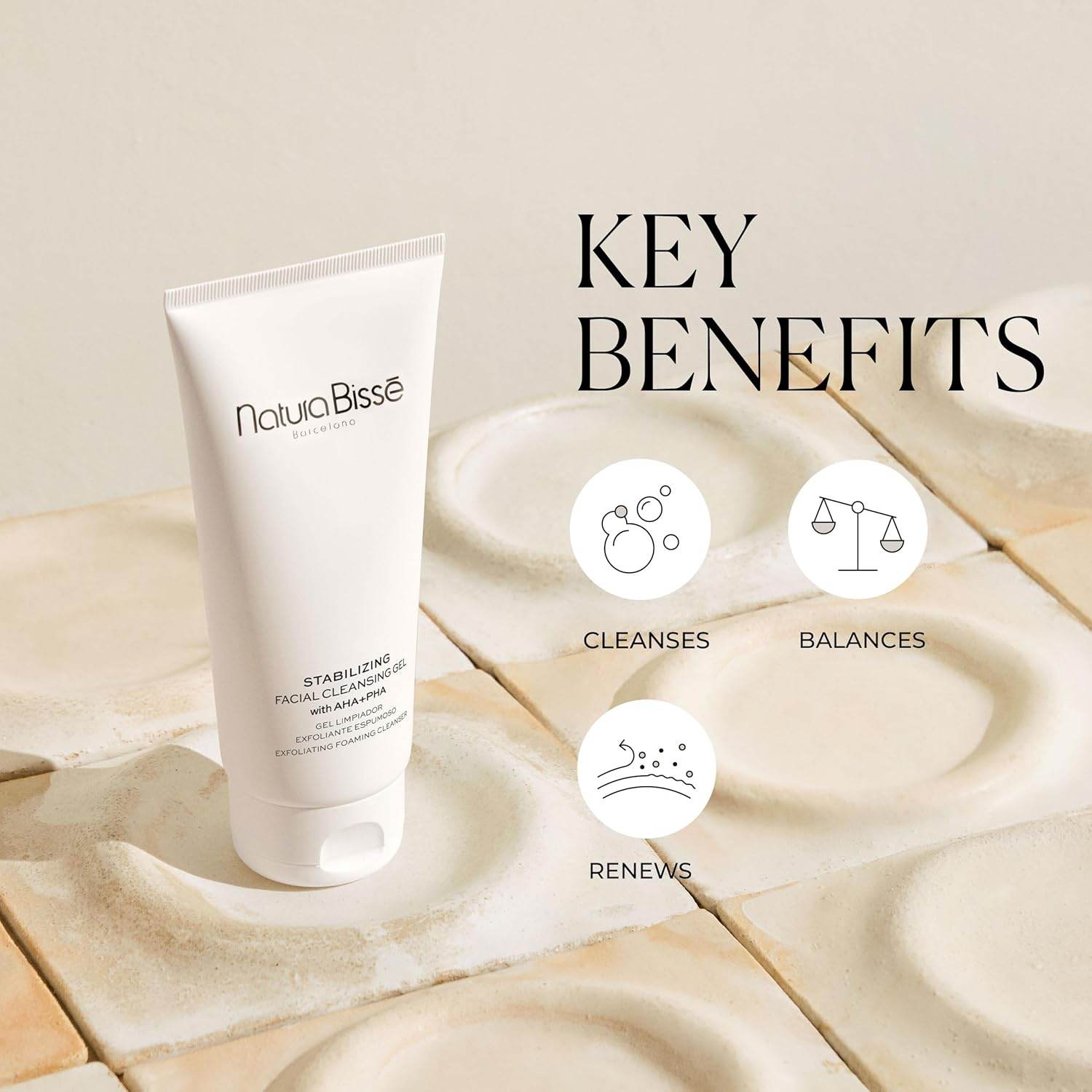 Natura Bisse Cleansing Exfoliating Gel in a white tube, highlighting its cleansing and balancing benefits