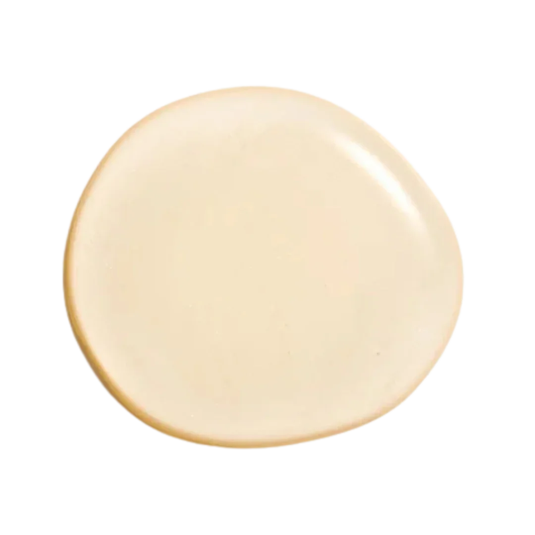 Natura Bisse Cleansing Exfoliating Gel in a smooth cream texture on a dark background