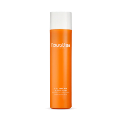 Natura Bisse C+C Vitamin Body Cream in vibrant orange packaging, promoting silky skin and hydration with firming body cream