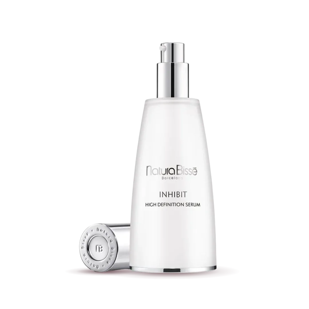 Natura Bisse Inhibit High Definition Serum in sleek bottle, a rejuvenating firming serum for youthful skin