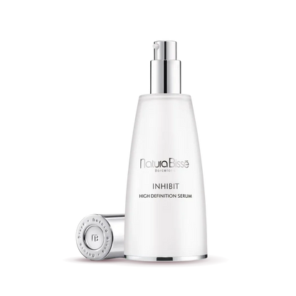 Natura Bisse Inhibit High Definition Serum in sleek bottle, a rejuvenating firming serum for youthful skin