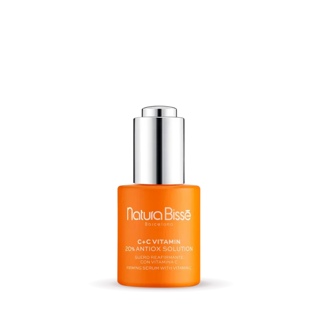 Natura Bisse Firming Serum with Vitamin C in a sleek orange bottle for skin rejuvenation