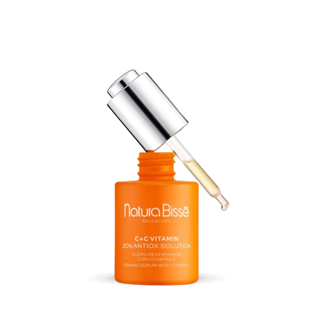 Natura Bisse Firming Serum with Vitamin C in orange bottle with dropper for brightening skin and reducing signs of aging