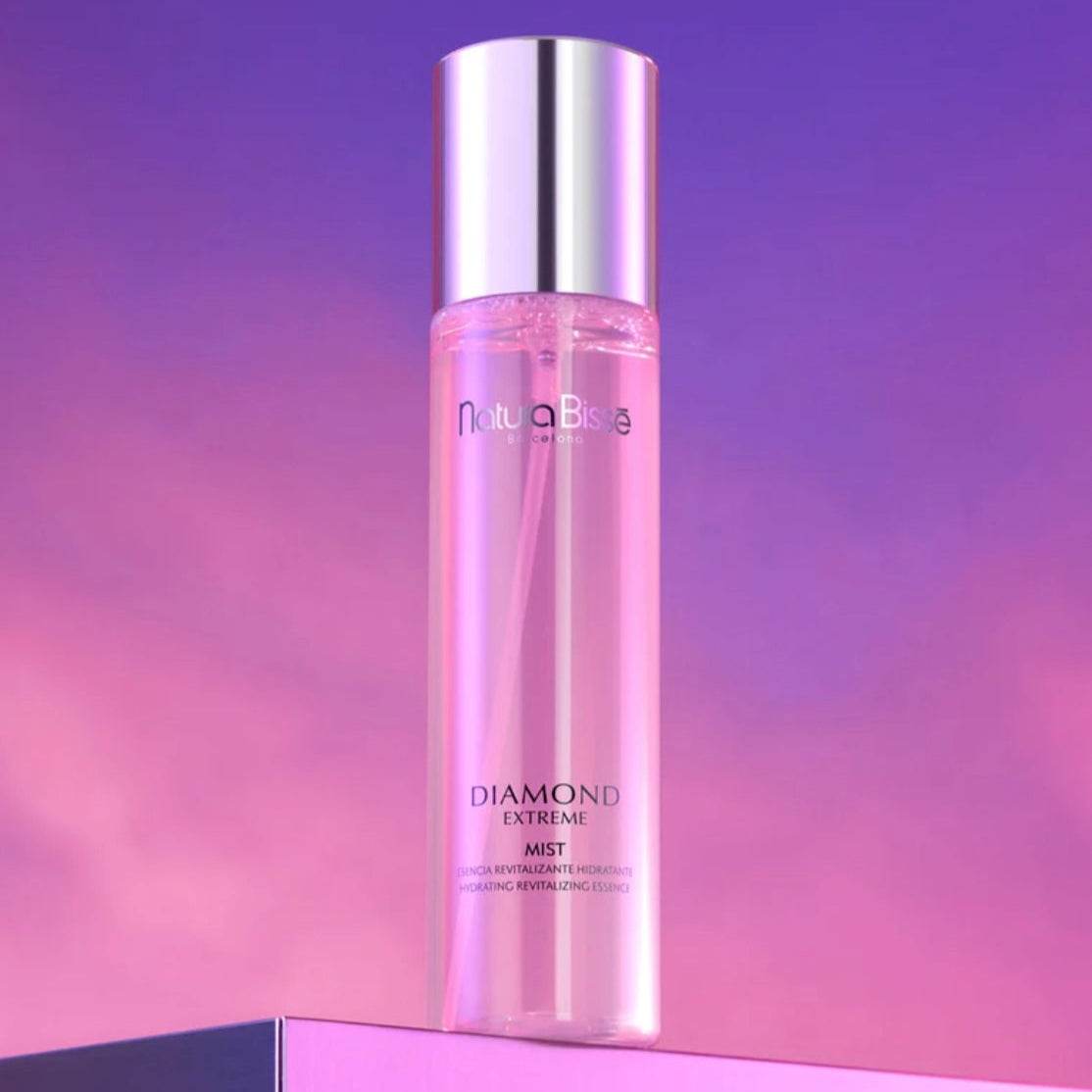 Natura Bissé Diamond Extreme Mist Hydrating Revitalizing Essence in a sleek bottle with a pink hue