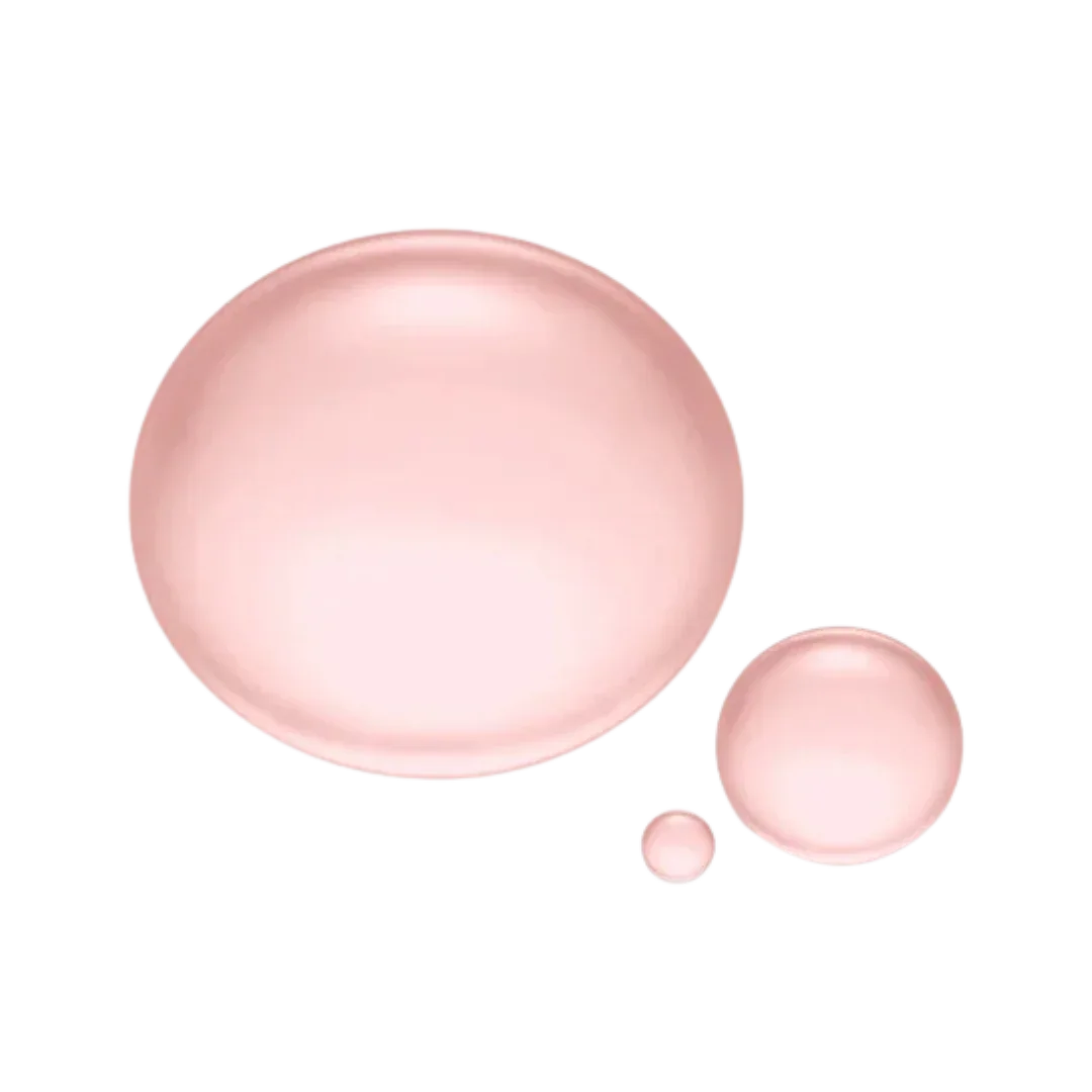 Natura Bissé Hydrating Revitalizing Essence shown in pink droplets on a black background
