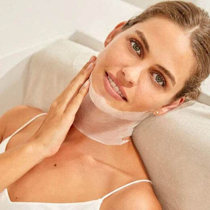 Natura Bissé Neck Mask applied on a woman for skincare and rejuvenation, showcasing smooth application