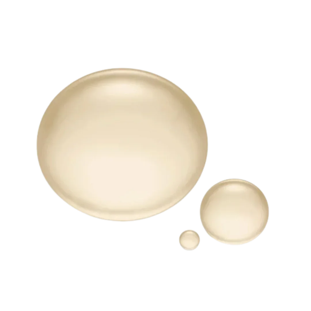 Natura Bissé Soothing Toner with creamy texture in various droplet sizes on a black background