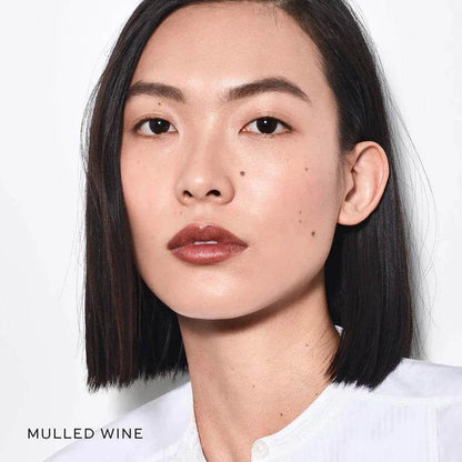 Westman Atelier Nude Lipstick Palette swatches with a model showcasing Mulled Wine shade on lips