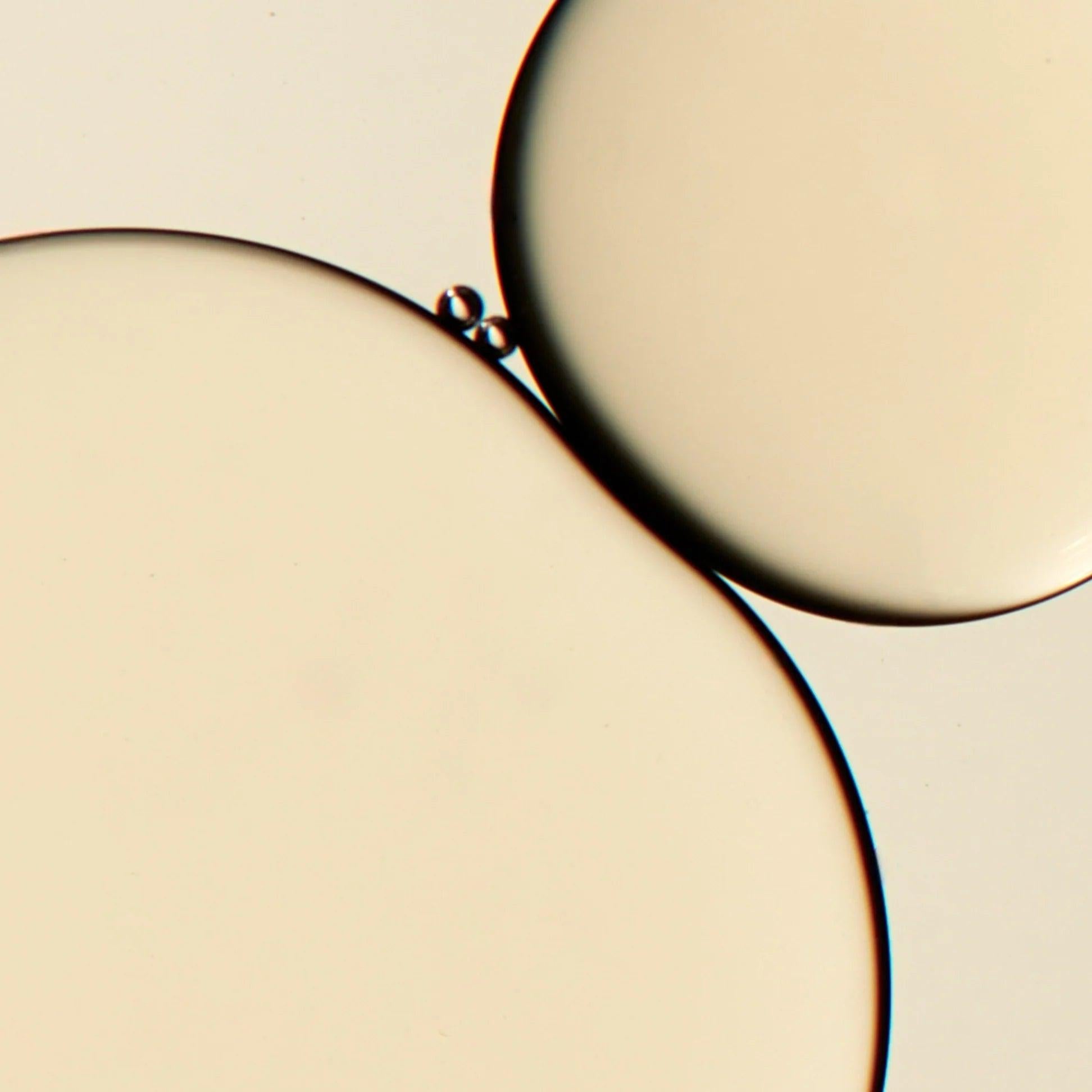 Close-up of Omorovicza Bakuchiol Facial Oil showing its smooth, silky texture and glowing appearance