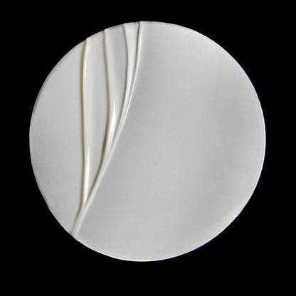 Smooth Omorovicza Barrier Cream on a white plate showcasing its creamy texture and luxurious feel