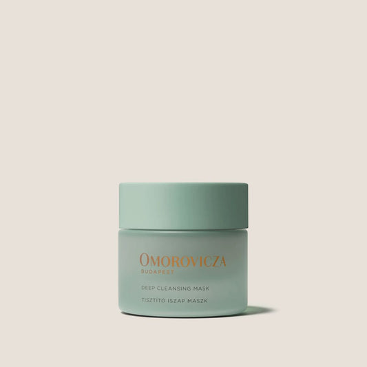 Omorovicza Deep Cleansing Mask in glass jar with a mint green lid for effective skin purification