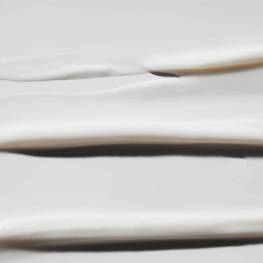 Smooth texture of Omorovicza Eye Lift Eye Cream on a white surface for rejuvenated skin