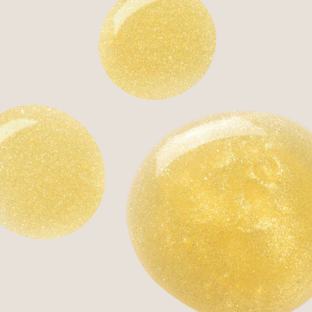 Omorovicza Gold Shimmer Oil droplets displaying a shimmering golden finish for radiant skin