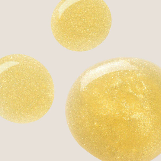 Omorovicza Gold Shimmer Oil droplets displaying a shimmering golden finish for radiant skin