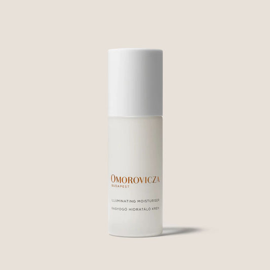 Omorovicza Illuminating Moisturizer in sleek white bottle with minimalist design