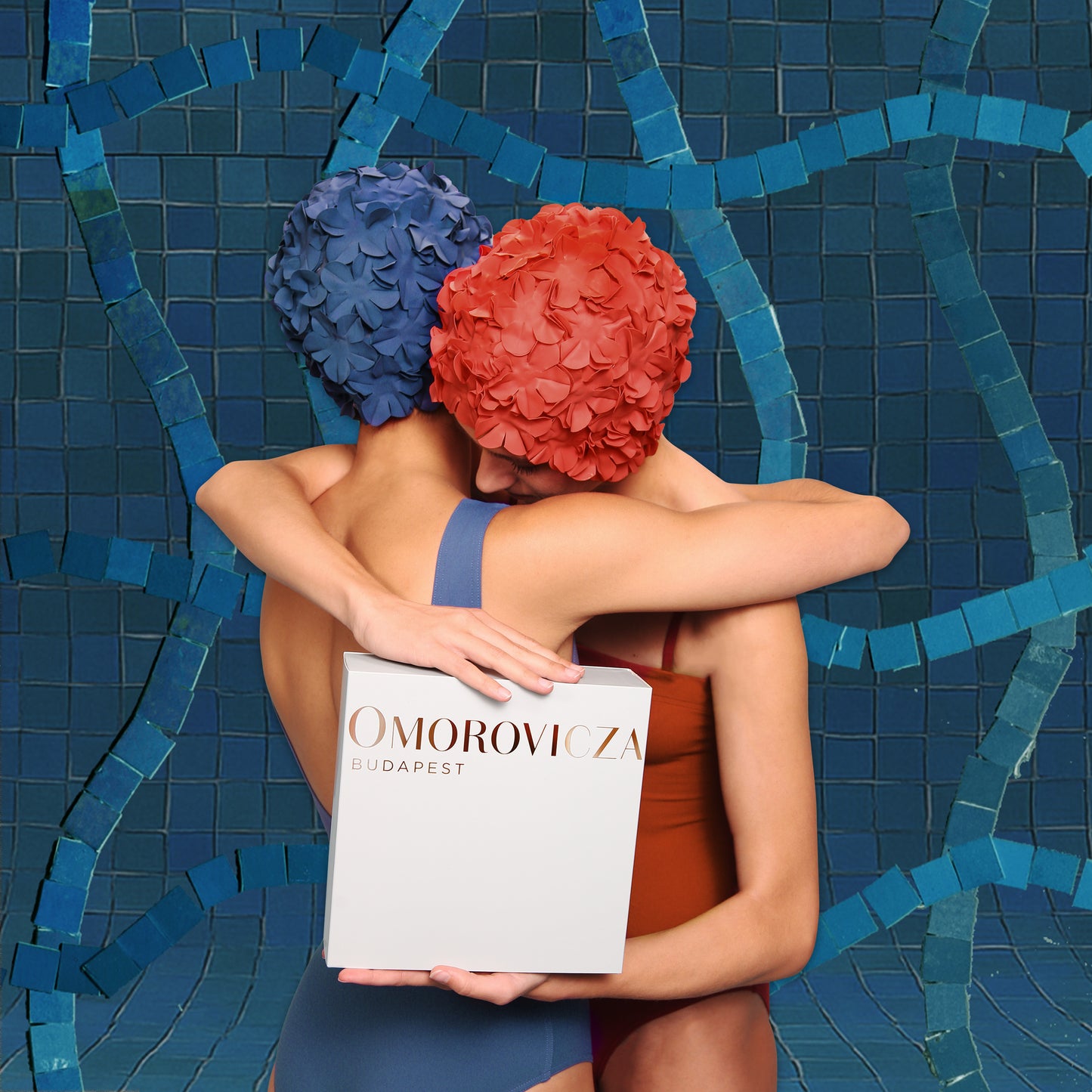 Omorovicza night and day Moisturizer duo elegantly presented in a sleek box with models embracing