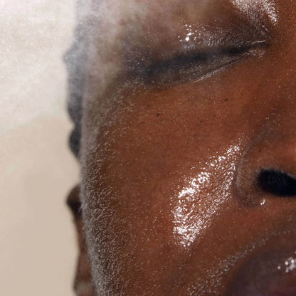 Close-up of a person enjoying the refreshing mist of Omorovicza Queen of Hungary Facial Mist