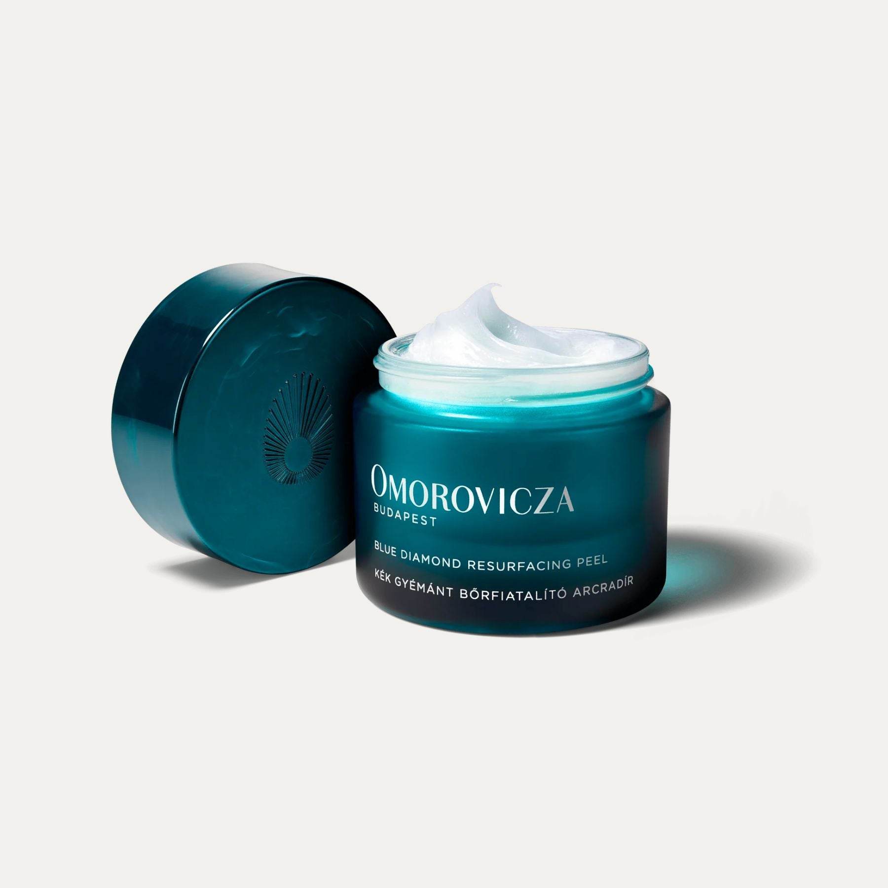 Omorovicza Blue Diamond Resurfacing Peel in a teal jar with a lid for skincare enthusiasts