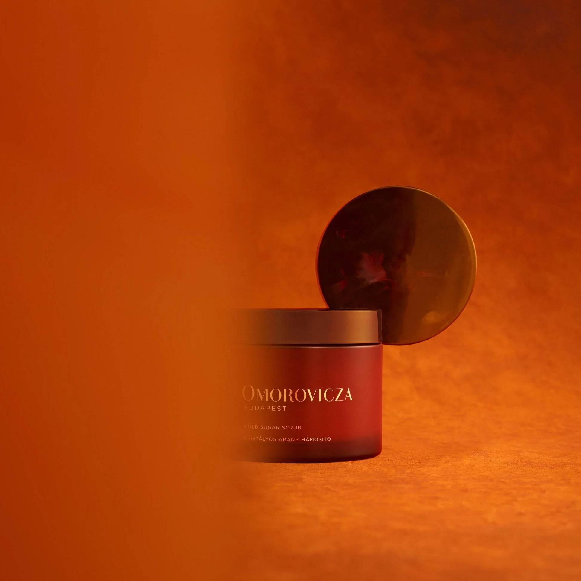 Omorovicza Sugar Scrub in a luxurious jar with a glossy bronze lid for skin exfoliation and hydration