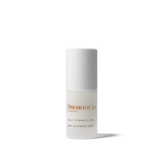 Omorovicza Vitamin C eye cream in a sleek bottle designed for brightening and nourishing the eye area