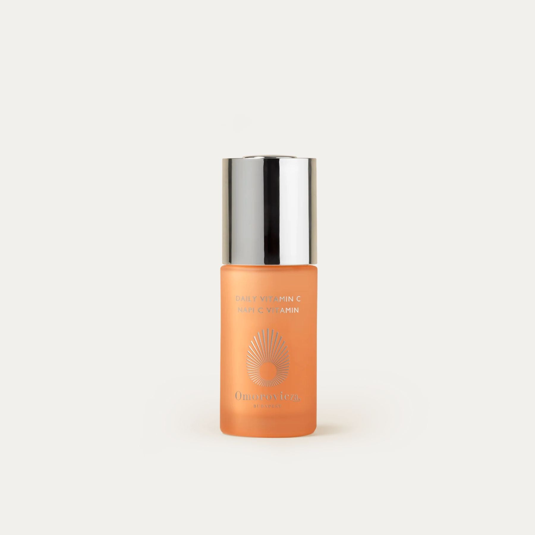 Omorovicza Daily Vitamin C Serum in a glass bottle with a silver cap for radiant skin