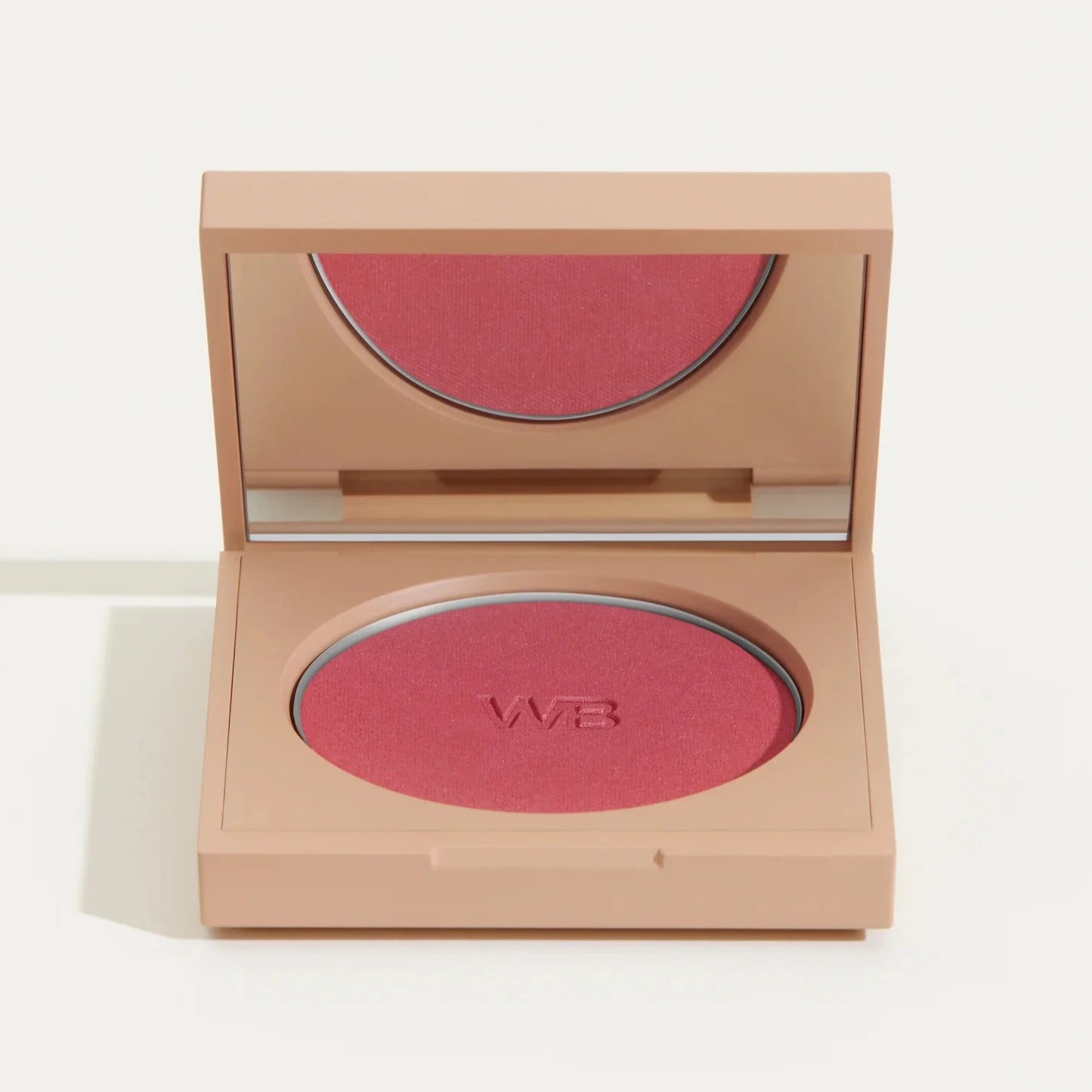 Wonderblush Powder Blush in a compact with a vibrant pink shade and mirror for easy application