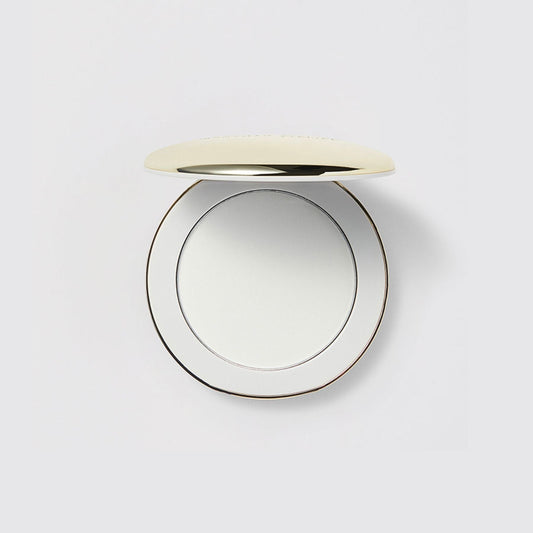 Westman Atelier Pressed Powder Compact with a Sleek Gold Lid for Flawless Skin Finish