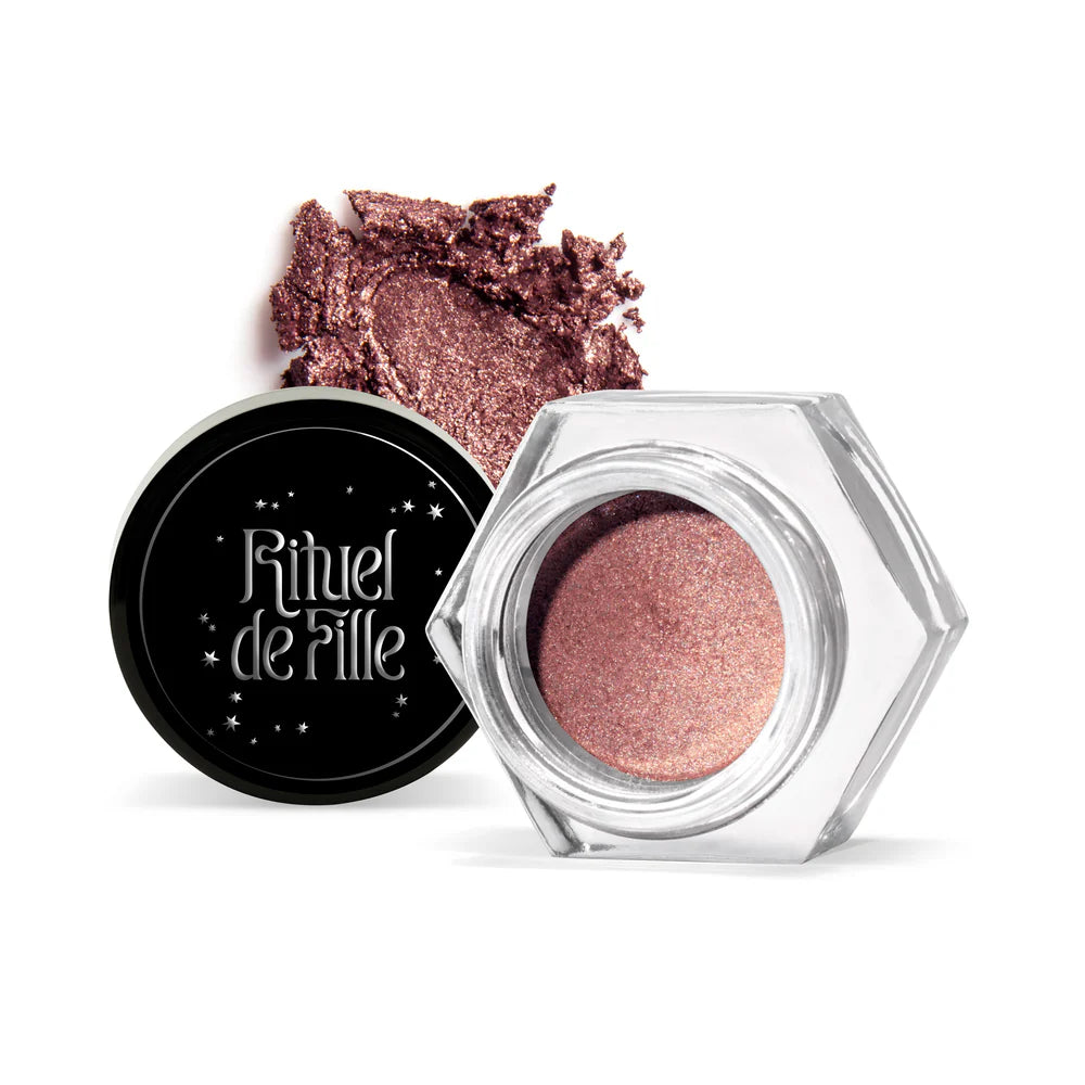 Rituel de Fille Cream Eyeshadow in a shimmery taupe shade with a hexagonal jar and loose pigment