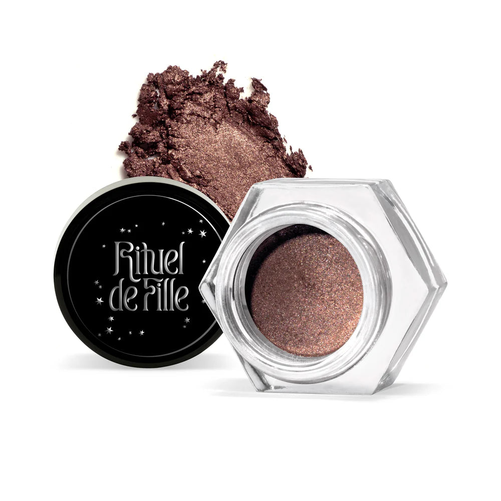 Rituel de Fille Cream Eyeshadow in a rich bronze shade with a sparkling finish and textured powder splash