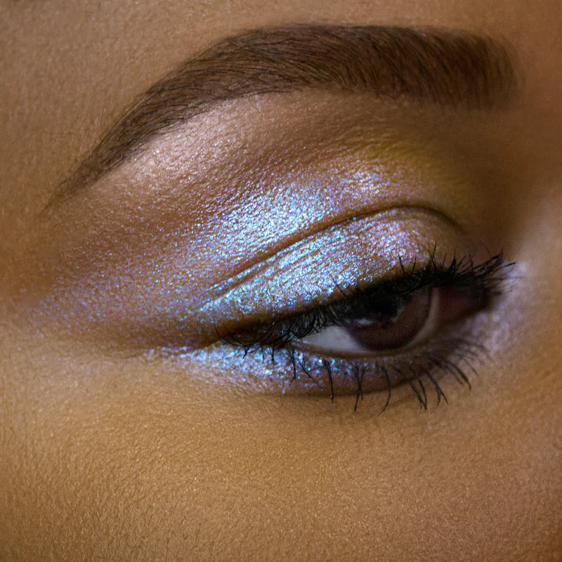 Shimmering Eye Gloss applied to eyelid for a radiant and colorful eye makeup look