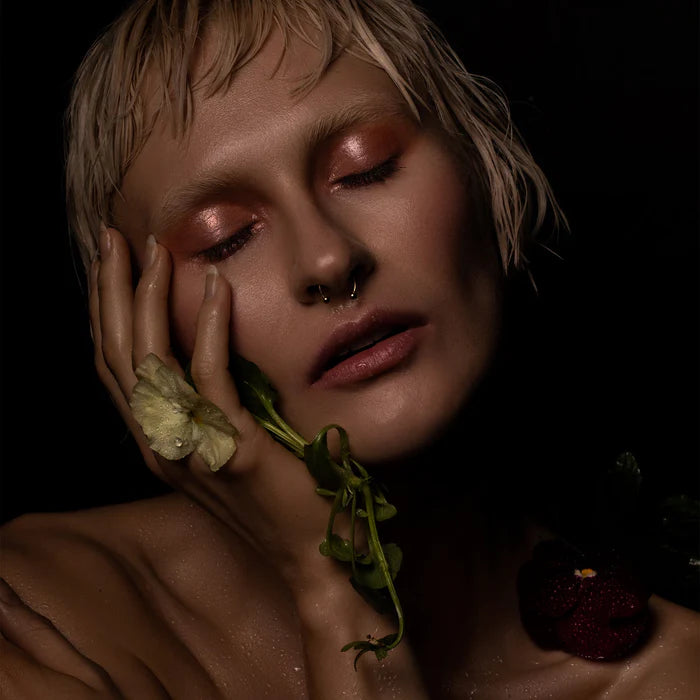 Rituel de Fille Eye Gloss in a natural beauty presentation with floral accents