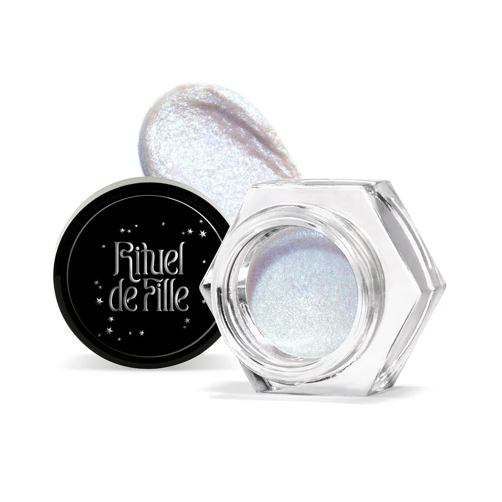 Rituel de Fille Eye Gloss in a clear hexagonal jar with a shimmering, ethereal finish for radiant eye looks