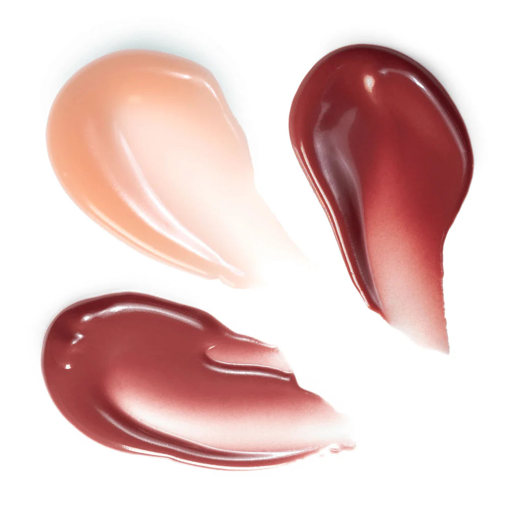 Rituel de Fille Lip Oil swatches in three colors for a glossy, moisturizing finish