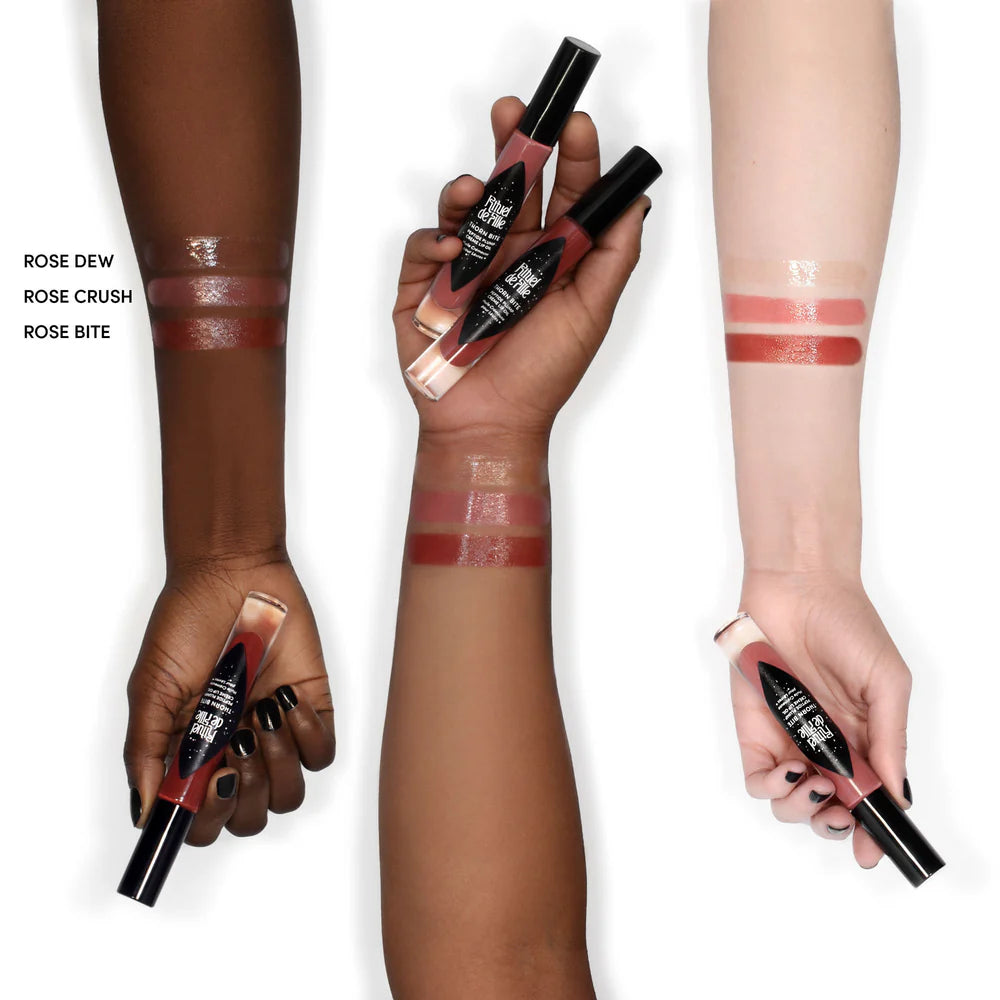 Rituel de Fille Lip Oil swatches on diverse skin tones showing Rose Dew, Rose Crush, and Rose Bite shades