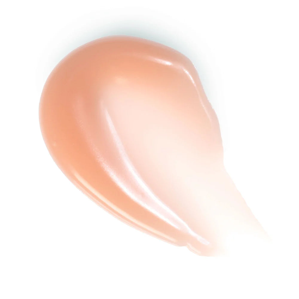 Rituel de Fille Lip Oil swatch showing a glossy peach tone, perfect for hydration and shine