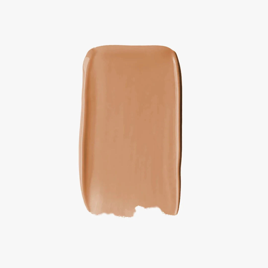 Sweed glass skin foundation swatch in a warm beige shade showing a smooth, luminous finish