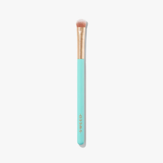 Sweed Eyeshadow Brush with a soft bristle head and a turquoise handle for precise makeup application
