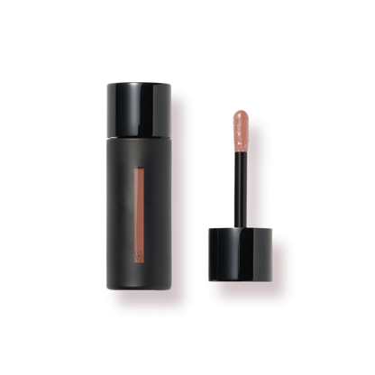 Westman Atelier Tinted Lip Balm in a sleek black container with a wand applicator for a natural lip tint