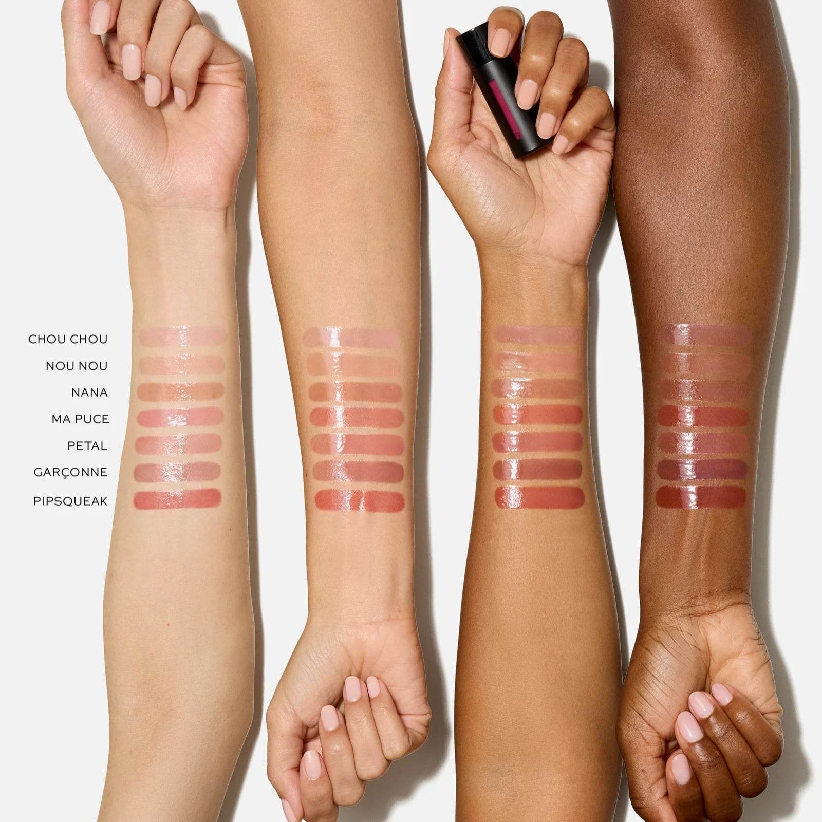 Swatches of Westman Atelier Tinted Lip Balm shades on different skin tones showcasing a variety of colors