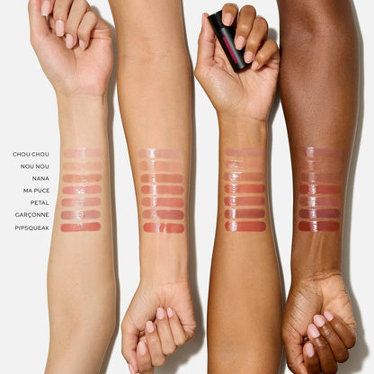 Swatches of Westman Atelier Tinted Lip Balm shades on different skin tones showcasing a variety of colors