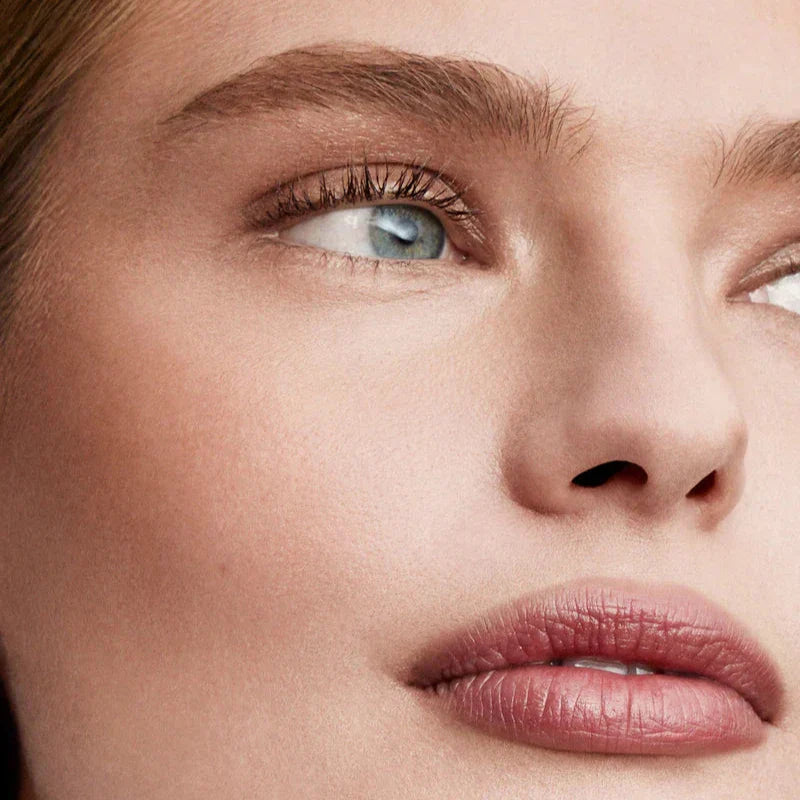 Close-up of a model's face showcasing natural makeup using Westman Atelier Powder Bronzer for a radiant look