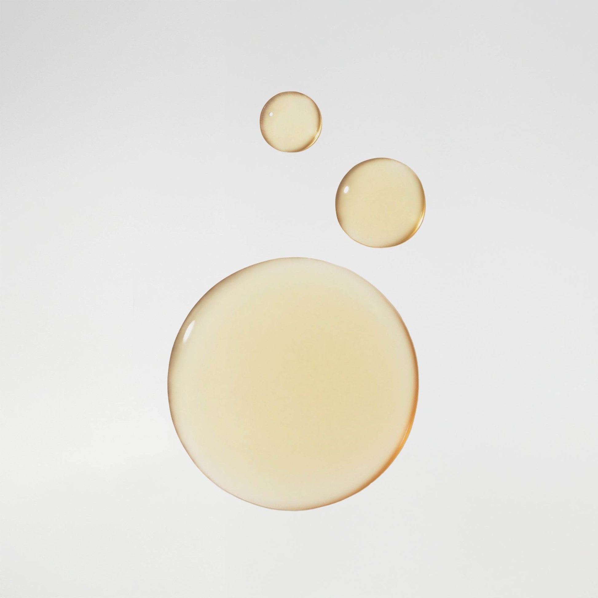 Vintner's Daughter Illuminating and Renewing Hydration serum oil drops on white background