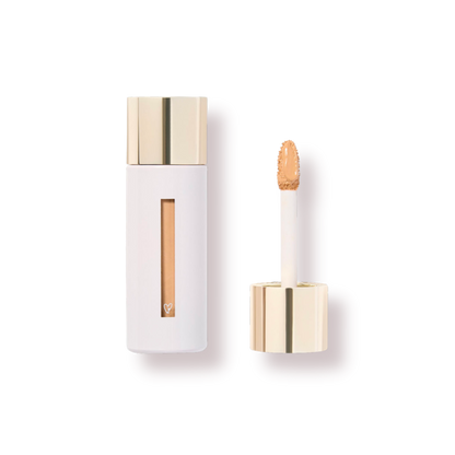 Westman Atelier Skincare Infused Concealer in a sleek white tube with a gold applicator wand