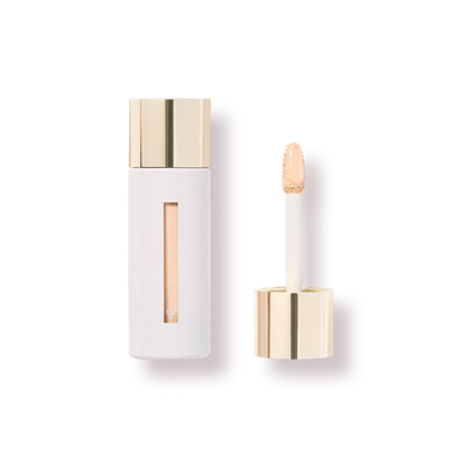 Westman Atelier Skincare Infused Concealer in a sleek white tube with a golden cap and applicator