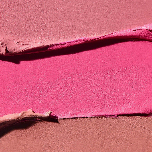 Swatches of vibrant pink shades from Westman Atelier Blush Stick showing creamy texture and blendability