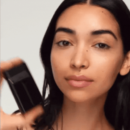 Westman Atelier Liquid Highlight being applied on a model's cheek for a radiant glow