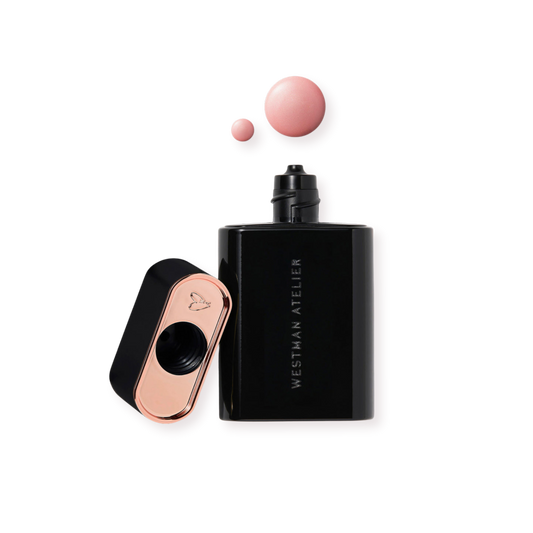 Westman Atelier Liquid Highlight in sleek black bottle with pink highlighter drops for a glowing look