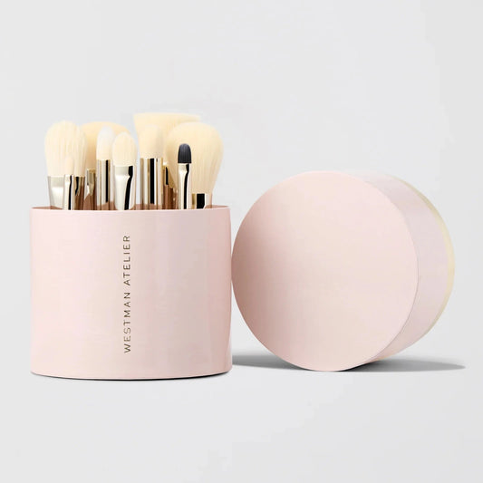 Westman Atelier Petite Brush Collection in a round pink container with various makeup brushes