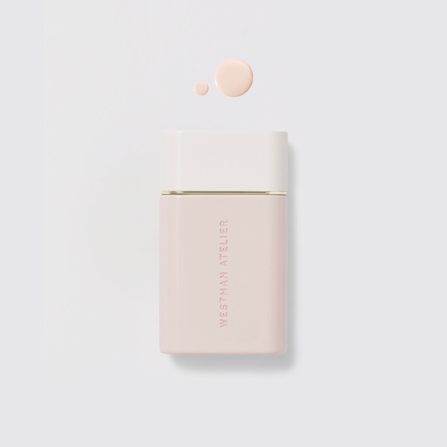 Westman Atelier Radiant Skin Tint in a sleek container with a drop of product for glowing skin